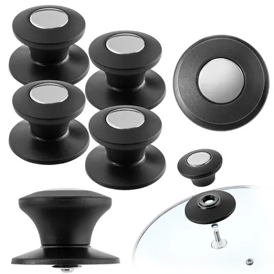 Multiple black pot lid handles with silver accents are arranged on a white background. One handle is shown attached to a glass pot lid.