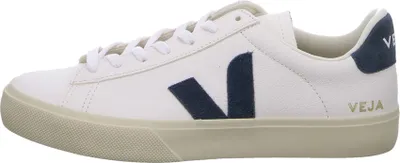 Side view of a white Veja sneaker with navy blue accents.