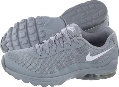A pair of gray Nike Air Max Invigor shoes are shown against a white background.