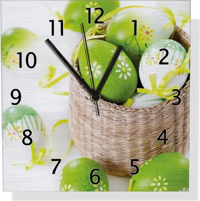 Produktbild von Wallario Design Wanduhr Ostergruß - bunte bemalte Ostereier in einem kleinen Körbchen aus Aluverbund, Größe 30 x 30 cm