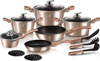 A collection of cookware and kitchen utensils arranged on a white background.