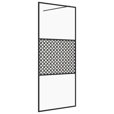 A black metal frame shower wall with a decorative patterned panel in the middle and clear glass sections above and below.