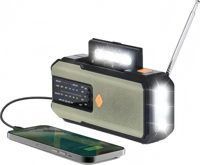 A multi-functional emergency radio with a built-in flashlight and a smartphone connected via USB.