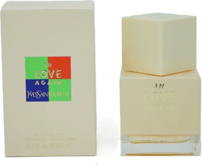 A perfume box and bottle are displayed side-by-side against a white background.
