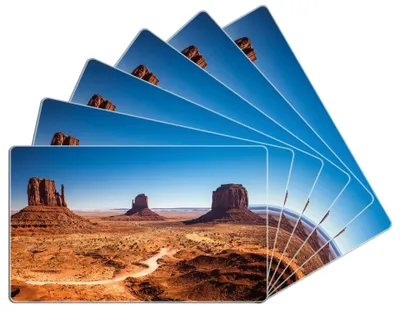 Produktbild von Wallario Frühstücksbrettchen 6er Set aus Glas, je 14 x 23 cm, mit rutschfesten Füßen, Motiv Monument Valley unter blauem Himmel