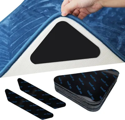 Produktbild von Set mit 18 dreieckigen und trapezförmigen Antirutschpads, wiederverwendbar für alle Arten und Größen von Teppichen