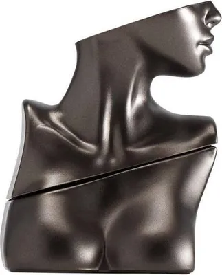A dark gray, abstract sculpture of a female torso and head, likely a perfume bottle.