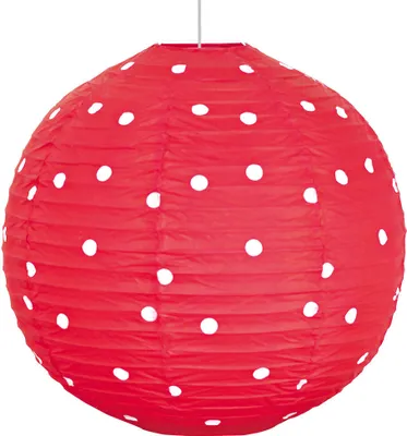A red polka dot paper lantern hanging from a string.