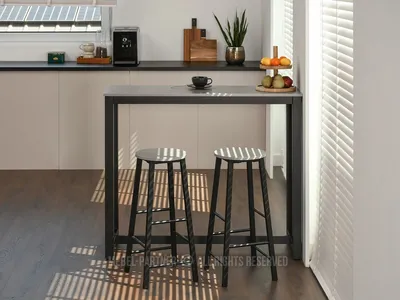 A bar set with two stools in a modern kitchen setting, with sunlight casting shadows on the floor.