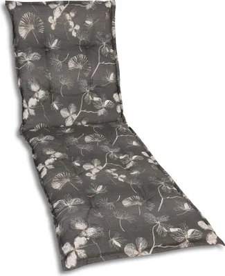 A close-up, studio shot of a chaise lounge cushion with a floral pattern.