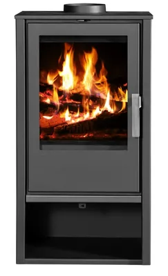 A front view of a modern, dark gray wood-burning stove with a glass door showing a fire burning inside.