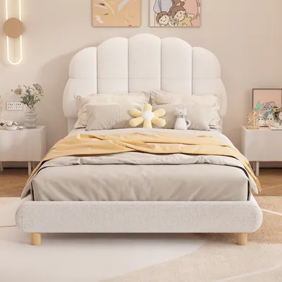 A bedroom scene with a bed, nightstands, and wall decor.