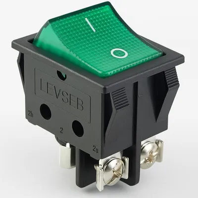 A single black and green rocker switch with screw terminals.