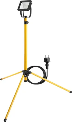 A yellow LED work light on a tripod stand with a black cord and plug.