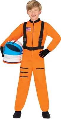 A young boy wearing an orange astronaut costume and holding a helmet.