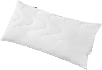 A white body pillow with a wavy quilted pattern, shown on a white background.