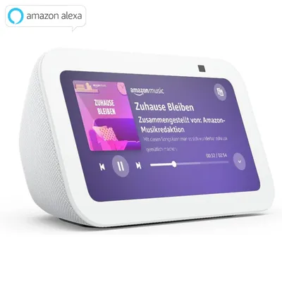 A white Amazon Echo Show 5 smart display is shown from a slightly elevated front-left angle, displaying music playback information on its screen.