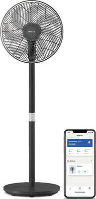A black standing fan next to a smartphone displaying an app interface.