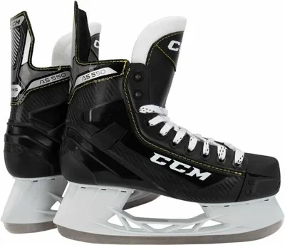 A pair of black CCM Tacks AS 550 hockey skates are shown from a side-angle against a white background.
