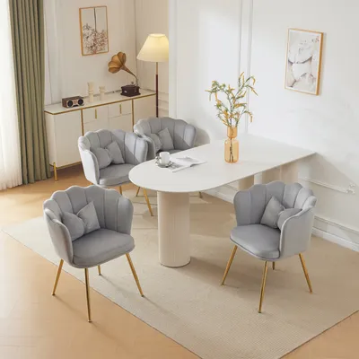 A dining set with four chairs and a table in a well-lit room.