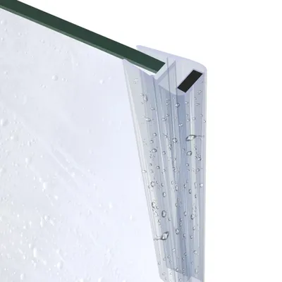A close-up view of a shower door seal with water droplets.
