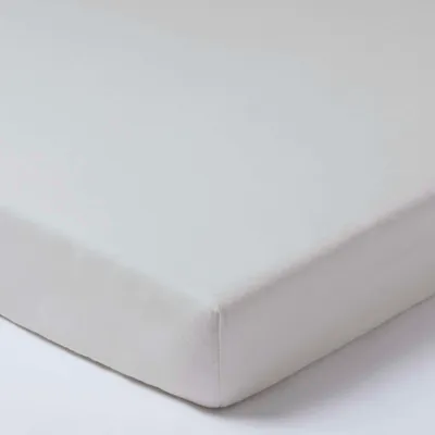 A close-up view of a pastel grey fitted sheet.