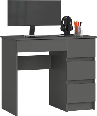 A dark gray computer desk with a monitor, headphones, and pens on top.