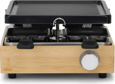 A raclette grill is shown from the front on a white background.
