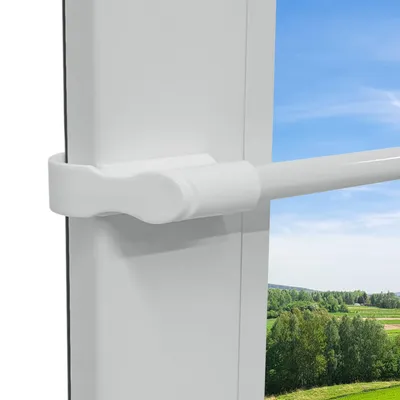 A close-up view of a white telescopic curtain rod attached to a window frame, with a blurred outdoor landscape visible through the window.