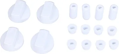 A set of white appliance knobs and adapters.