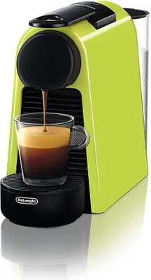 A close-up shot of a lime green Nespresso coffee machine brewing espresso into a glass cup.