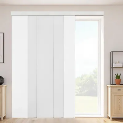 A white panel blind system covering a large window in a room with wooden flooring and furniture.