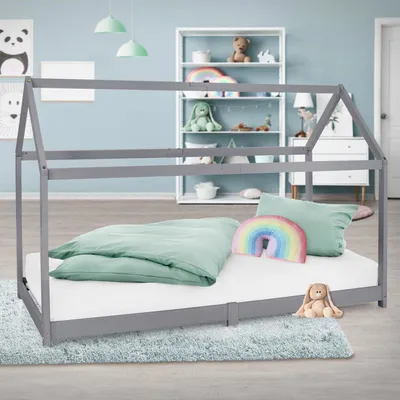 A child's bedroom with a house-shaped bed.