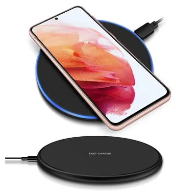 A smartphone is placed on a wireless charging pad, with a second charging pad shown below.