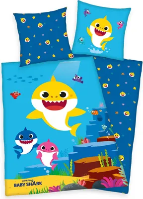 A collection of Baby Shark themed bedding items, including pillowcases and a duvet cover, displayed against a light blue background.