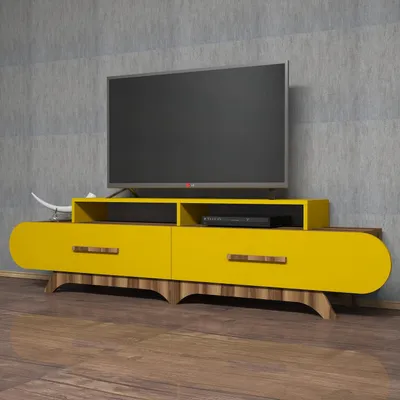 A modern yellow TV stand with wooden accents, featuring a television on top, set against a textured gray wall and a wooden floor.