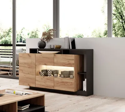 A modern sideboard in a living room setting, with a large window in the background.
