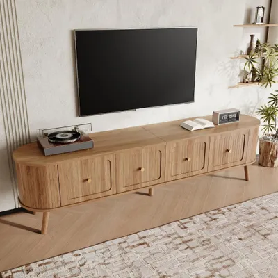 Image de Meuble TV moderne au design unique, 4 portes et poignées dorées, pieds en bois, idéal pour le salon. Dimensions du meuble TV : 180 x 38 x 47 cm, couleur chêne