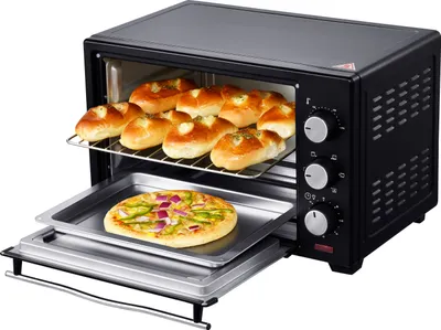 A black Steinborg minibackofen with a pizza and baked goods inside.