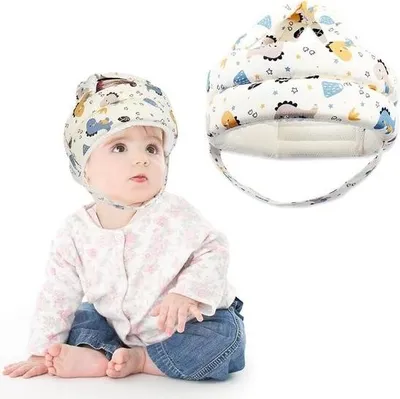 Zdjęcie produktu dla Pierwszy kask do nauki chodzenia - Niebieski dinozaur - Regulowany kask ochronny dla dzieci w wieku od 6 do 36 miesięcy.