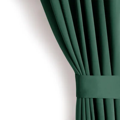 A close-up view of a dark green curtain with pleats and a band.