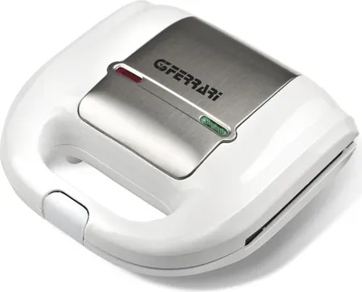 A white sandwich maker with a silver metallic top.