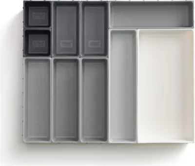 A set of drawer organizers arranged neatly on a white surface.