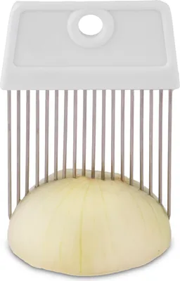 A close-up shot of an onion being sliced by a kitchen tool.