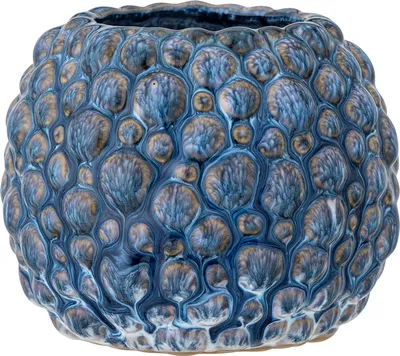 A close-up studio shot of a decorative ceramic pot.