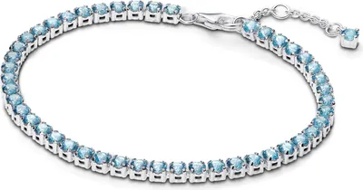 A silver tennis bracelet with blue stones on a white background.