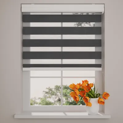 A window with blinds and a vase of flowers on the windowsill.