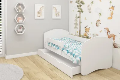 A child's bedroom with a white bed and pull-out drawer.