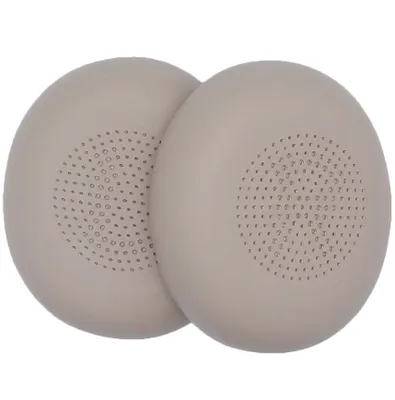 Two beige ear pads for headphones are shown on a white background.