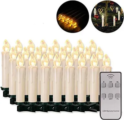 A collection of LED Christmas tree candles with a remote control.